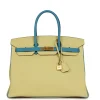 Hermès Special Order (HSS) Birkin 35 Jaune and Bleu Paradise The interior is lined with Bleu Paradise chevre and has one zip pocket with an Hermes engraved zipper pull and two open pockets on the opposite side. Collection: T Origin: France Condition: Pre-owned; Mint - the bag retains its structure. There is no wear to the exterior leather. The hardware shows light scratching. The interior is clean. Accompanied by: Hermes box, Hermes dustbag, clochette, lock, two keys, clochette dustbag, rainhat and carebook Measurements: 13.75