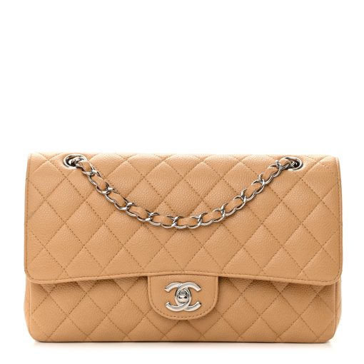 Madison Avenue Couture offers a brand-new, unworn Chanel Medium Double Flap Bag in Beige Caviar Leather with Silver Hardware.